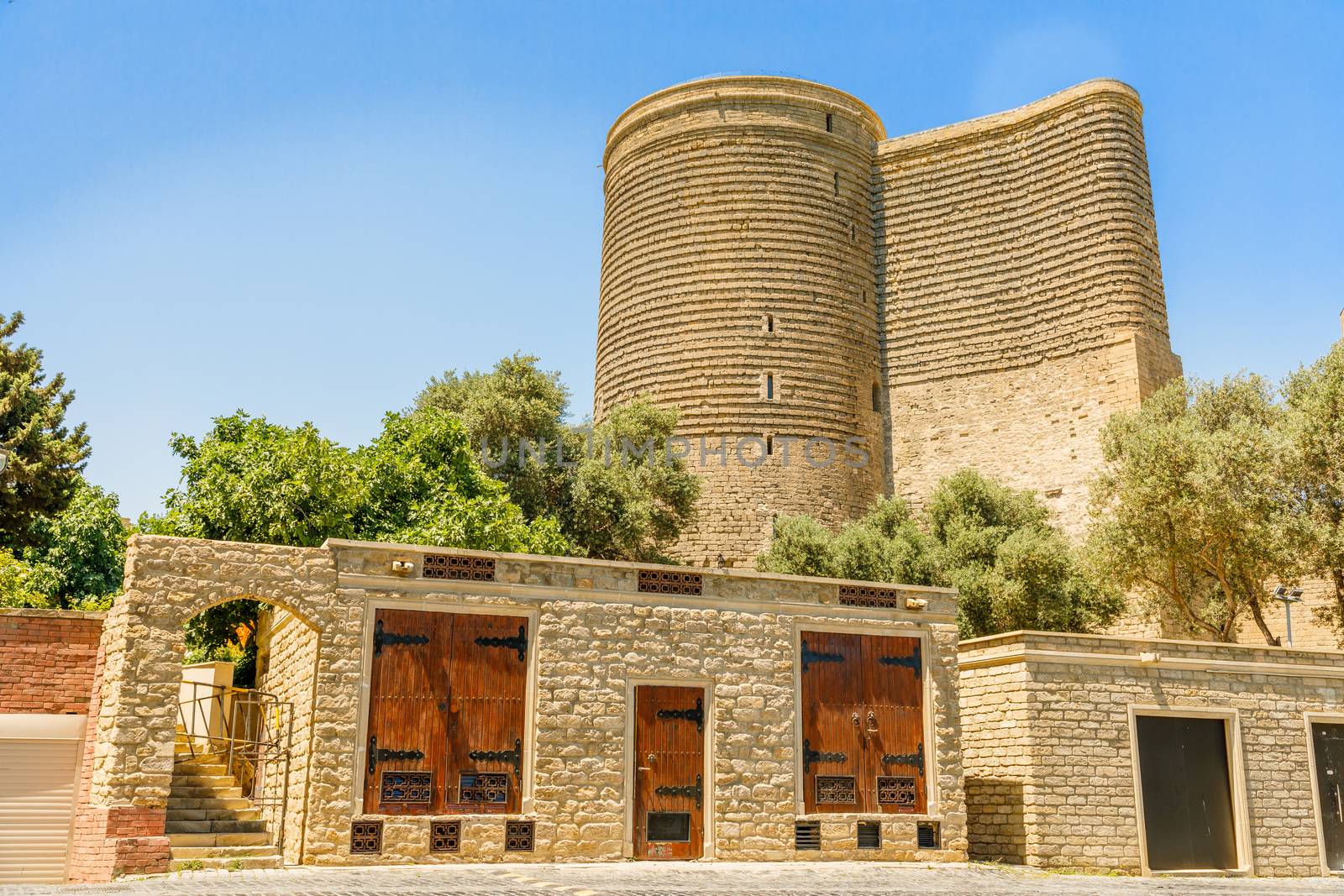 Azerbaijani stone buildings with  Gız Galası medieval Maiden tower, old town, Baku, Azerbaijan