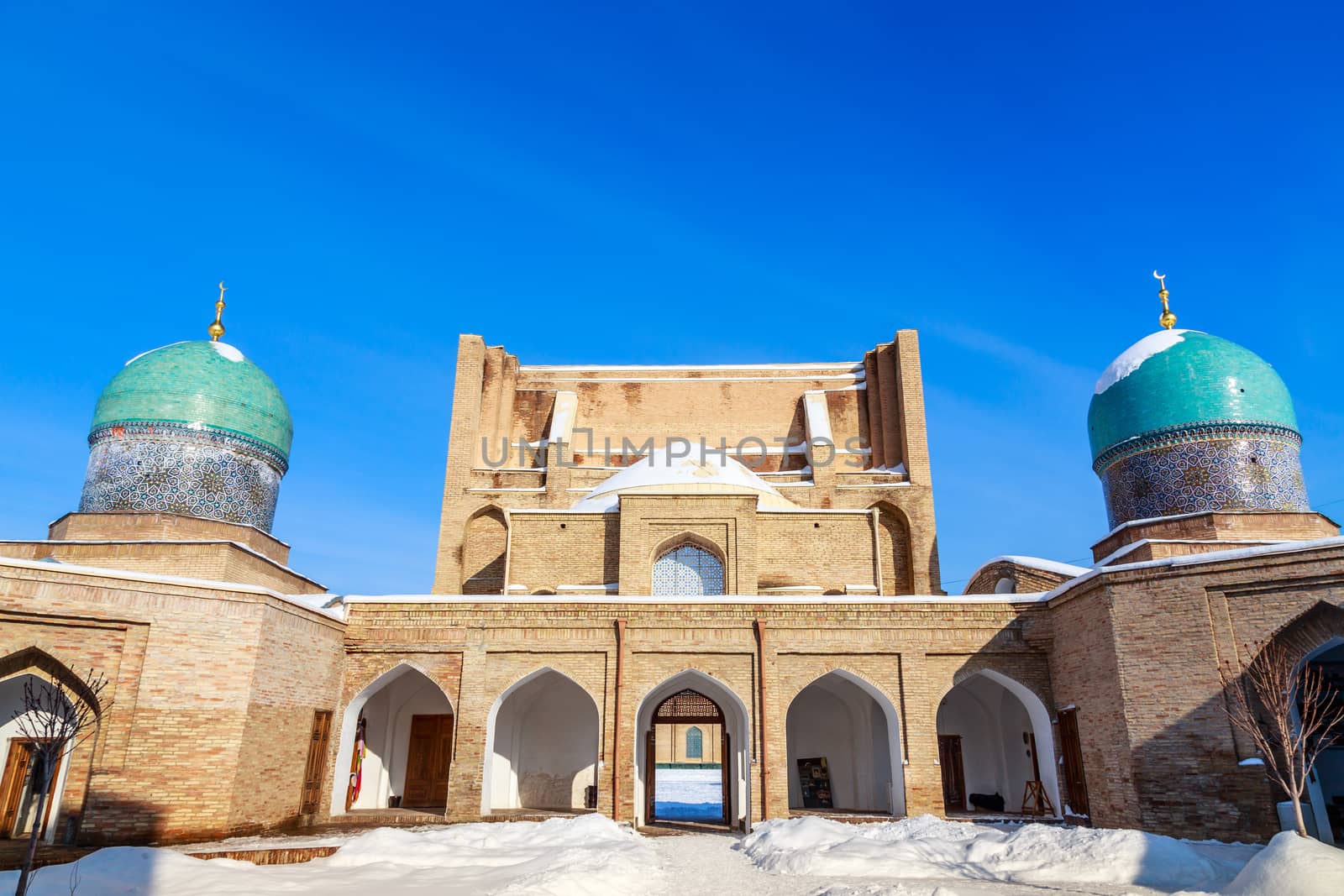 Snow and blue domes and minarets of Hazrati Imam complex, religious center of Tashkent, Uzbekistan