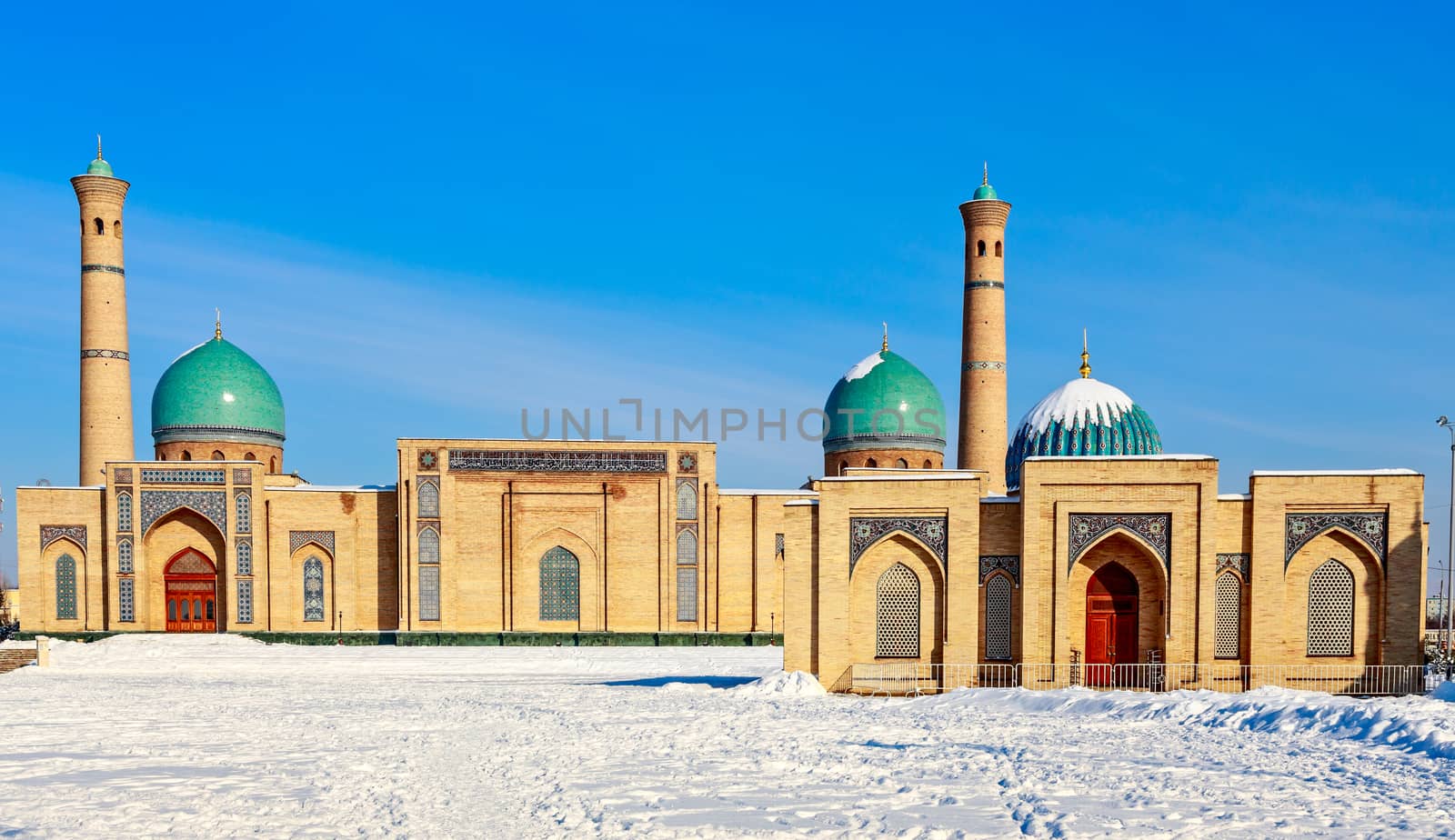 Snow and blue domes and minarets of Hazrati Imam complex, religious center of Tashkent, Uzbekistan