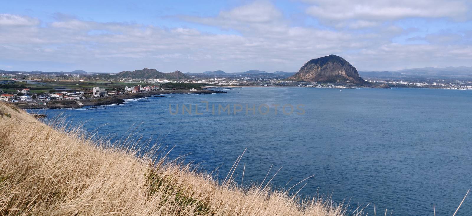 Sanbang-san mountain landscape seen from across ocean in Jeju Island, South Korea