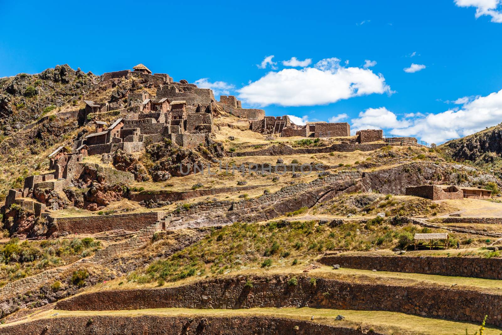 Ruins of ancient Incan citadel  with terraces on the mountain, Pisac, Peru