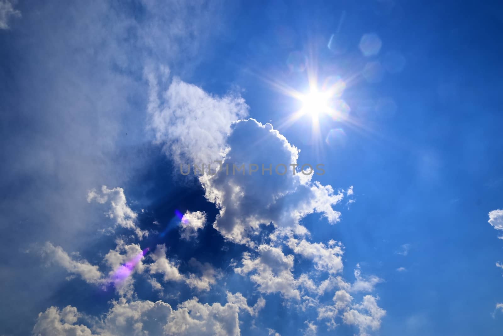 Beautiful view at sunbeams with some lens flares and clouds in a by MP_foto71