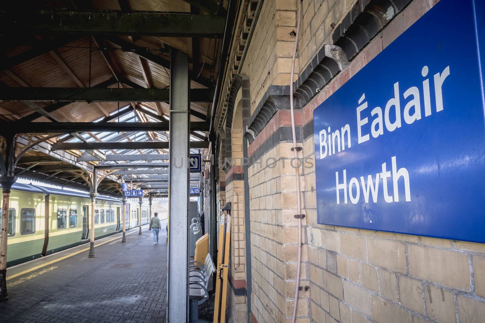 Howth near Dublin, Ireland - February 15, 2019: Passengers walking on the platform of the Howth Binn Eadair DART train station on a winter day