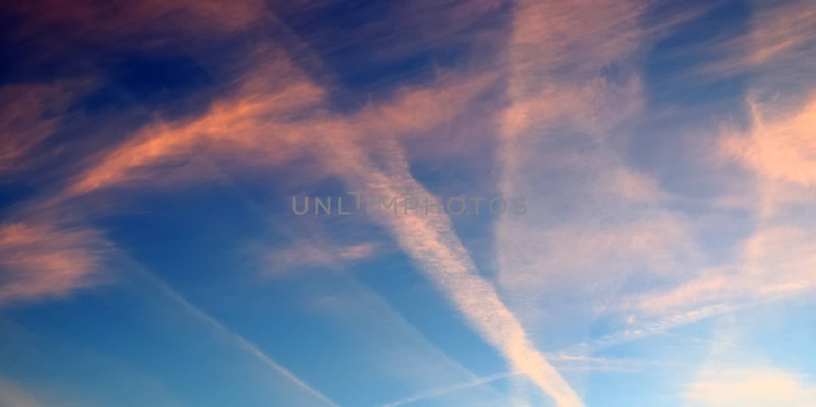Aircraft condensation contrails in the blue sky inbetween some c by MP_foto71