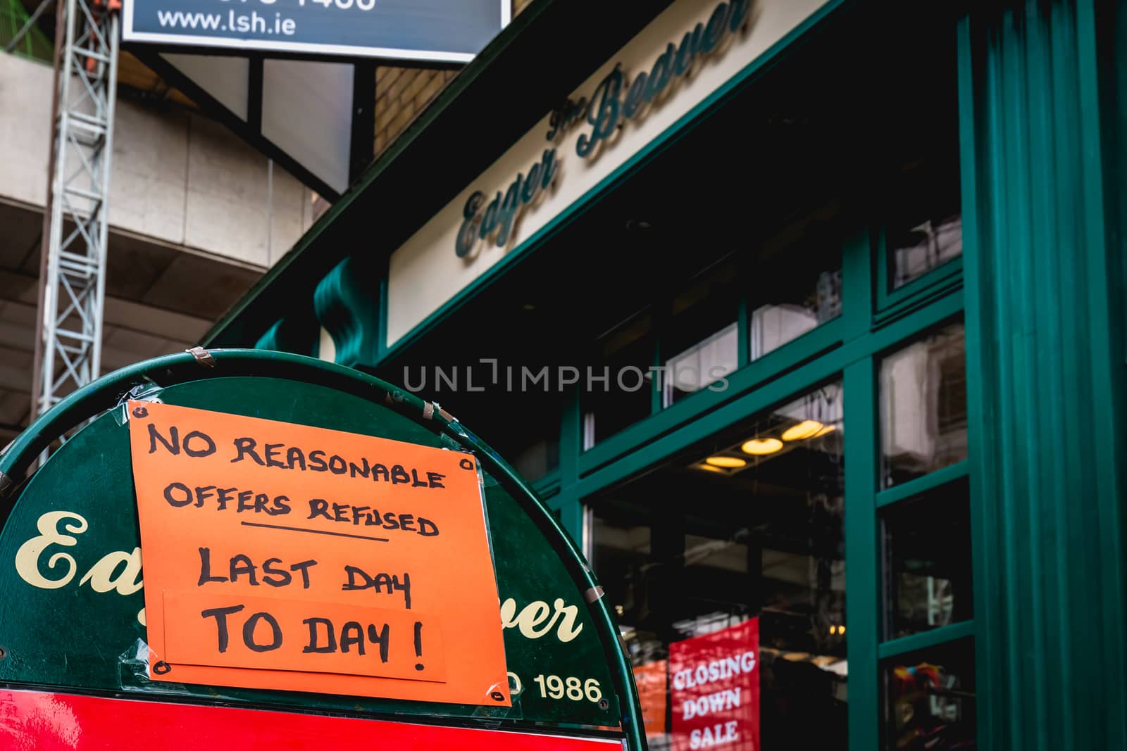 Dublin, Ireland - February 16, 2019: No reasonable offers refused - Last day to day - on a street sign outside a city center store on a winter day