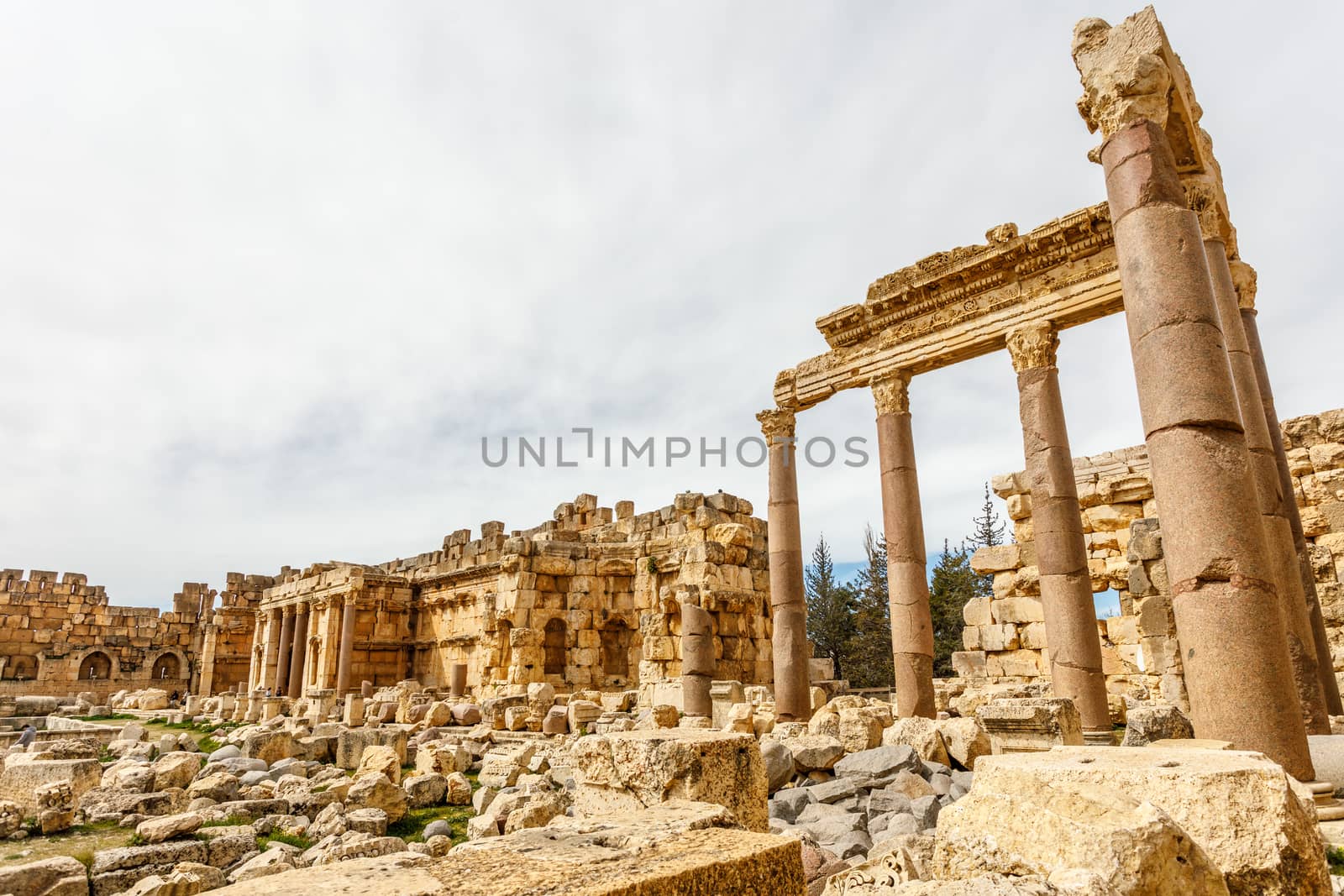 Ancient ruined walls and columns of Grand Court of Jupiter templ by ambeon