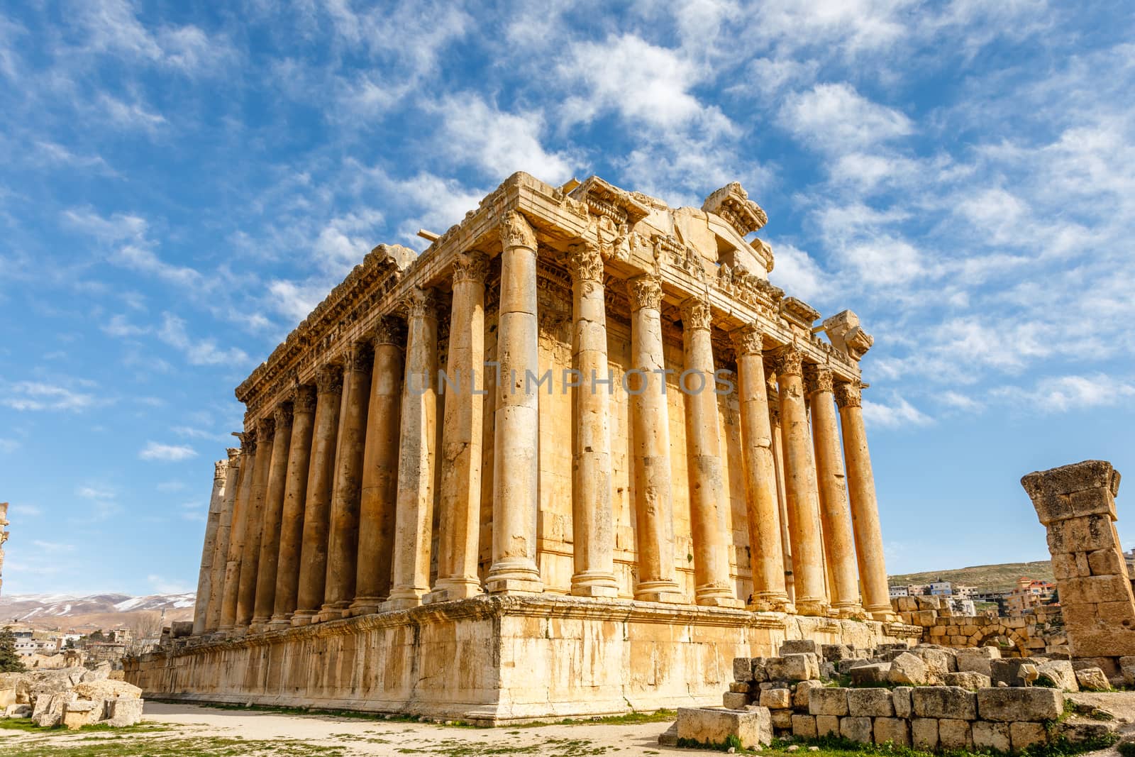 Ancient Roman temple of Bacchus with surrounding ruins and blue sky in the background, Bekaa Valley, Baalbek, Lebanon