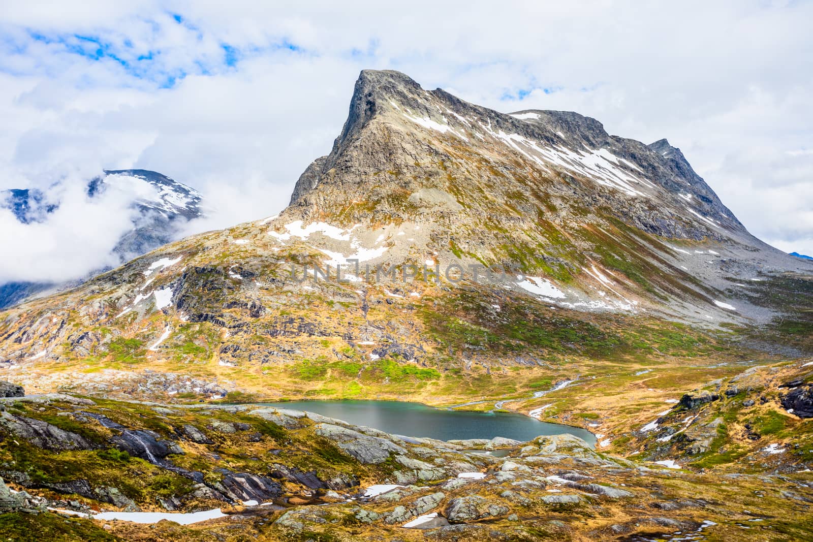 Snow mountain peak around Alnesvatnet lake panorama, path of trolles, Trollstigen, Rauma Municipality, More og Romsdal, county, Norway
