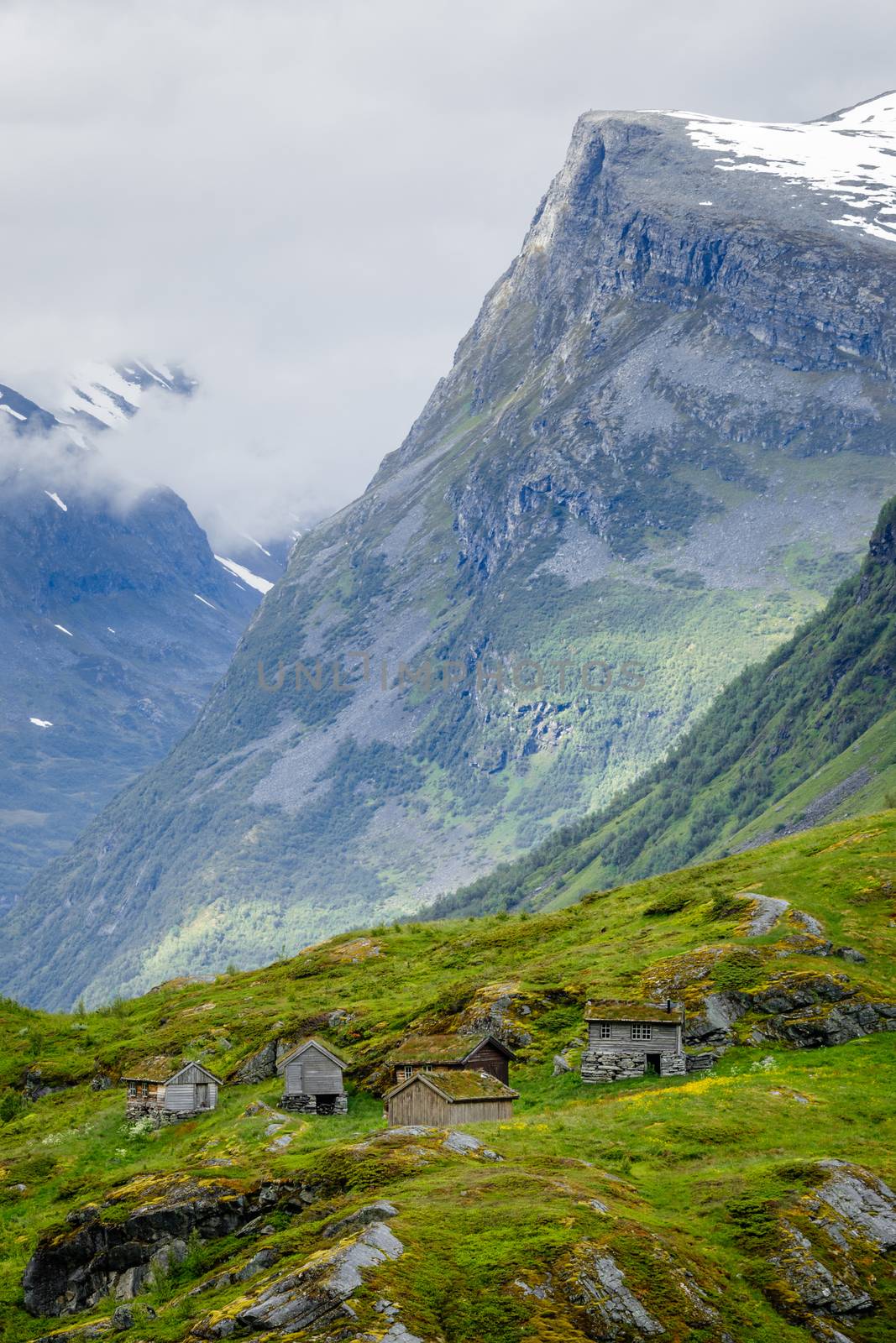 Norwegian mountain village with traditional turf roof houses, Geiranger, Sunnmore region, More og Romsdal county, Norway
