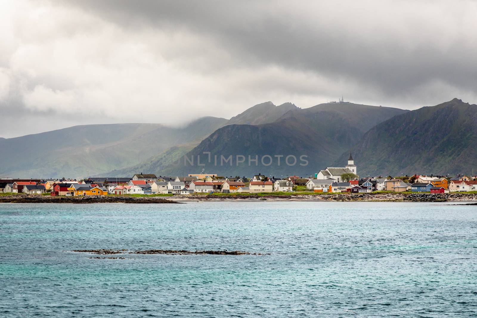 Andenes village panorama with multiple houses and mountains in t by ambeon