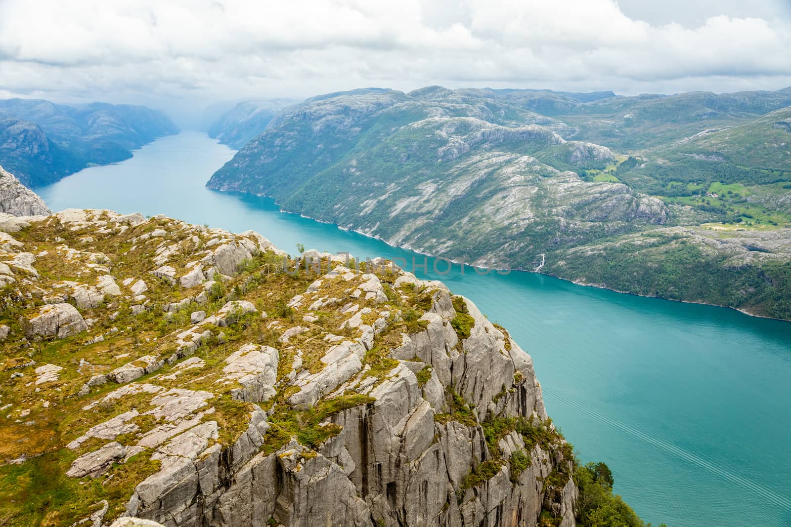 Panoramic mountain view to the long narrow and blue Lysefjord, P by ambeon