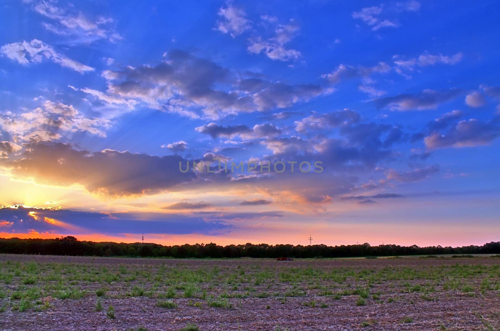 Beautiful and romantic sunset at a lake in stunning yellow and orange colors