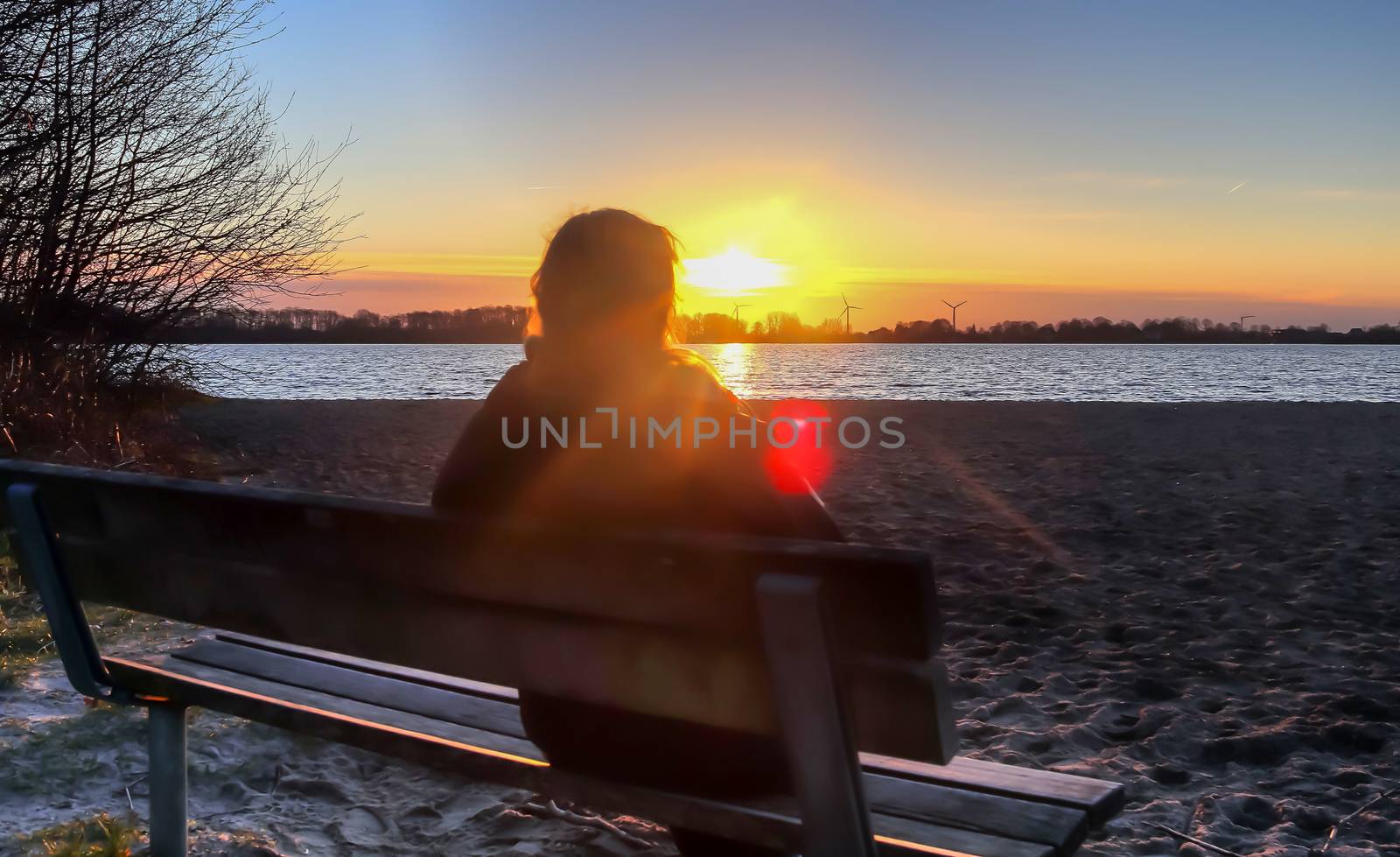 Beautiful and romantic sunset at a lake in stunning yellow and orange colors