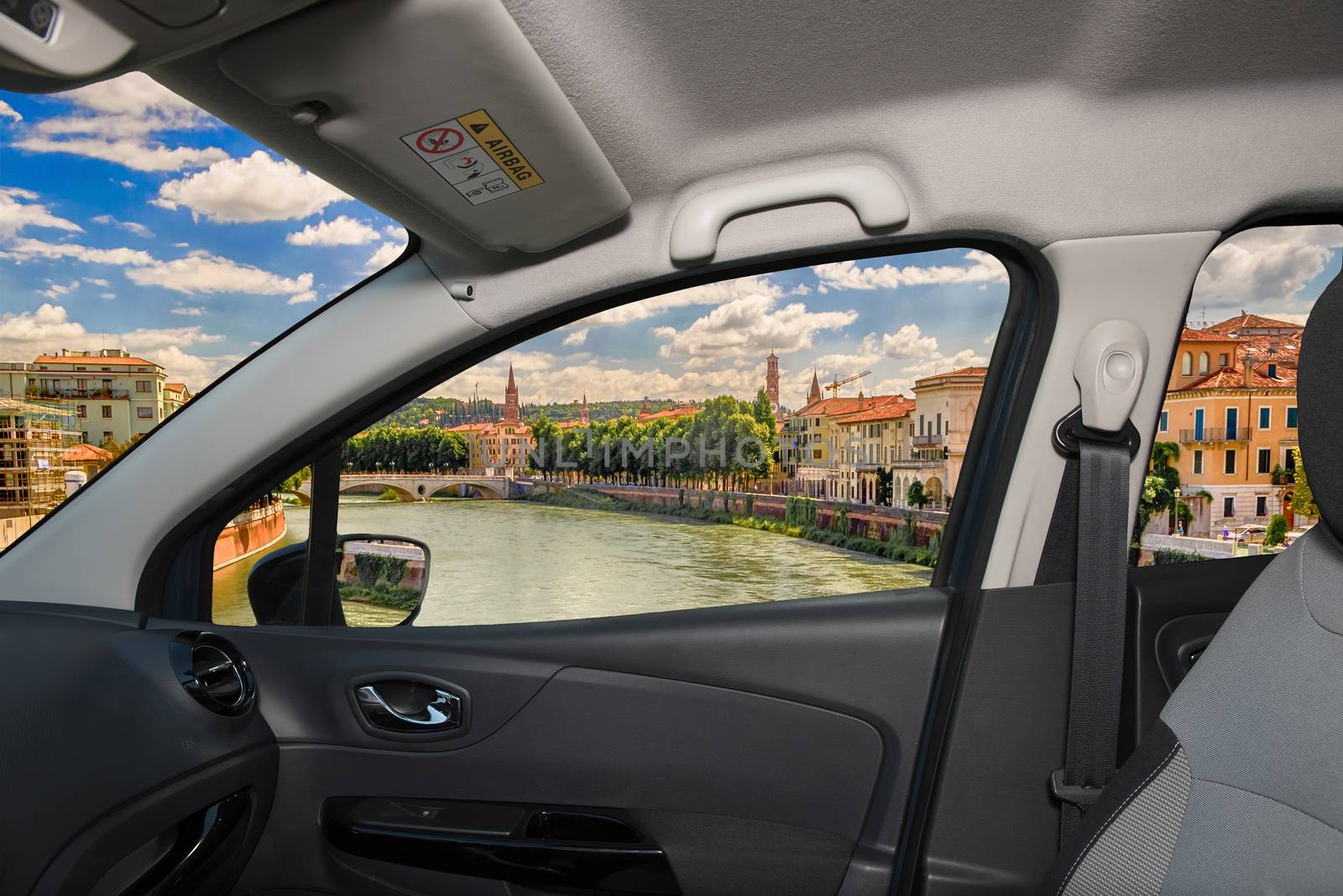 Looking through a car window with view over Adige River in central Verona, Italy