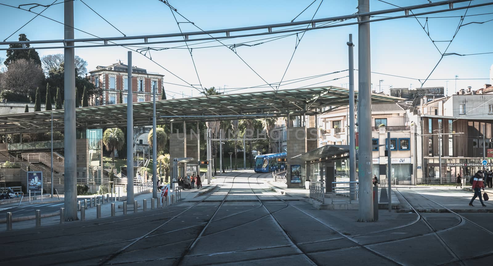 Montpellier, France - January 2, 2019: electric tramway passing the Corum, a convention center and Opera Berlioz on a winter day