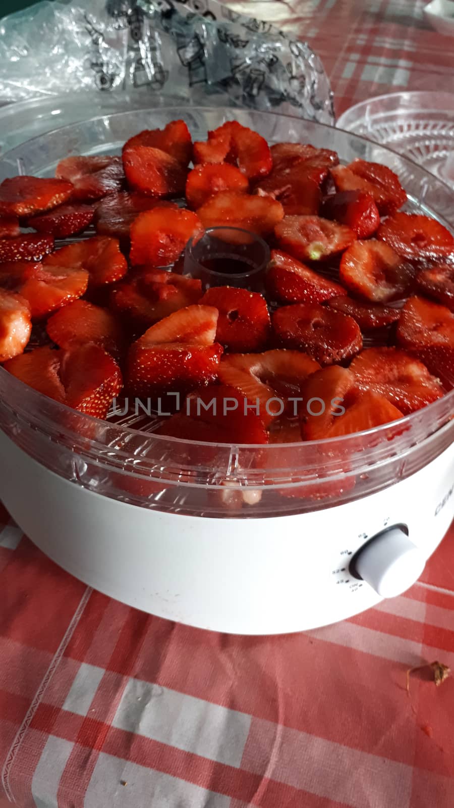 Ripe juicy red strawberry in a white cup. strawberry crop.