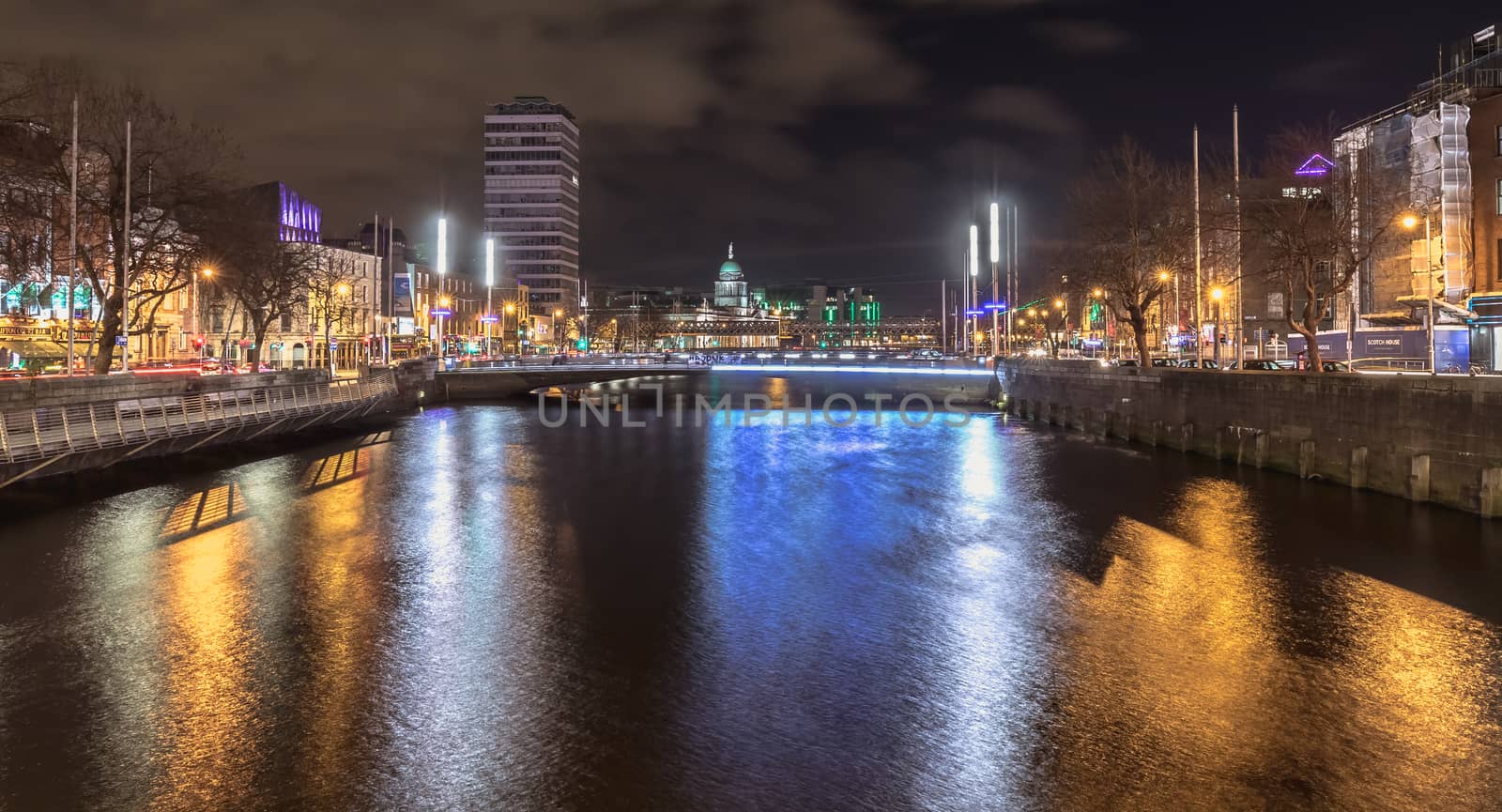 Dublin, Ireland - February 15, 2019: street atmosphere and architectural detail at night in the historic city center where people walk on a winter evening