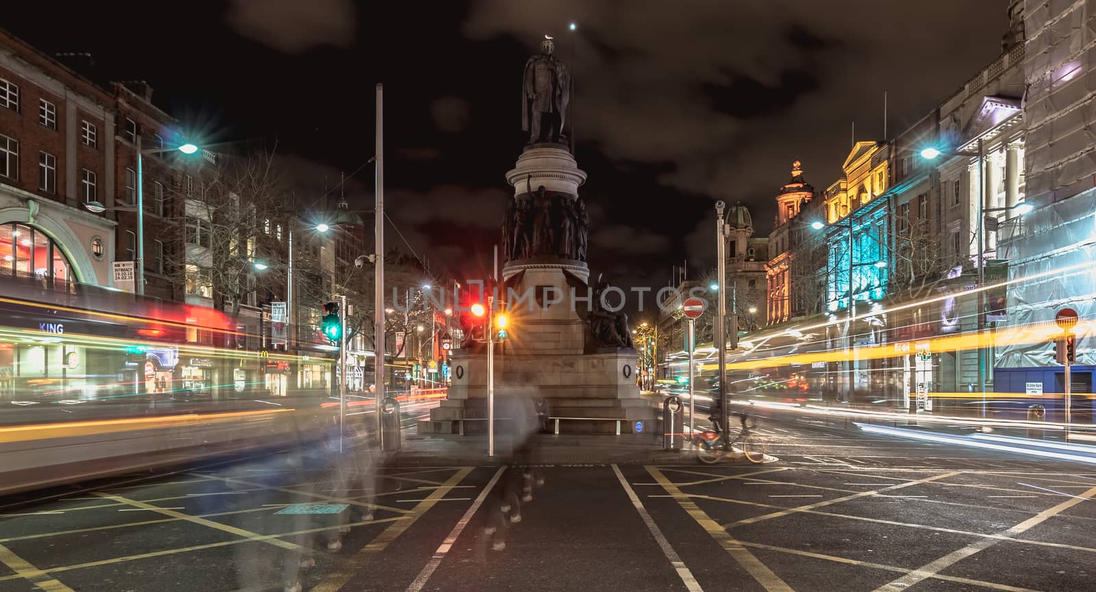 Dublin, Ireland - February 15, 2019: street atmosphere and architectural detail at night in the historic city center where people walk on a winter evening