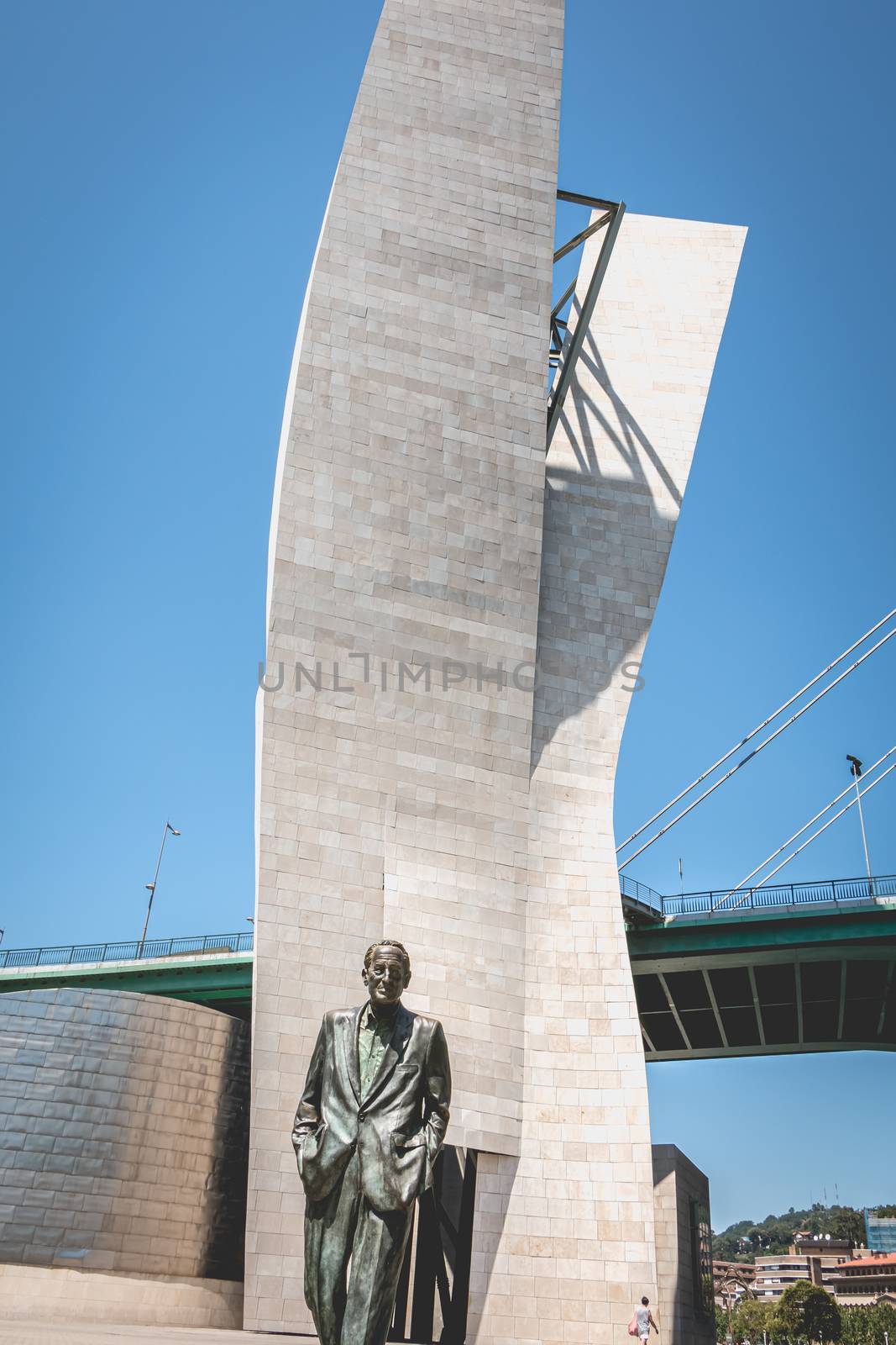 Bilbao, Spain - July 19, 2017: Monument of the socialist leader Ramon Rubial Cavia by Casto Solano, In front of the Guggenheim museum on a summer day