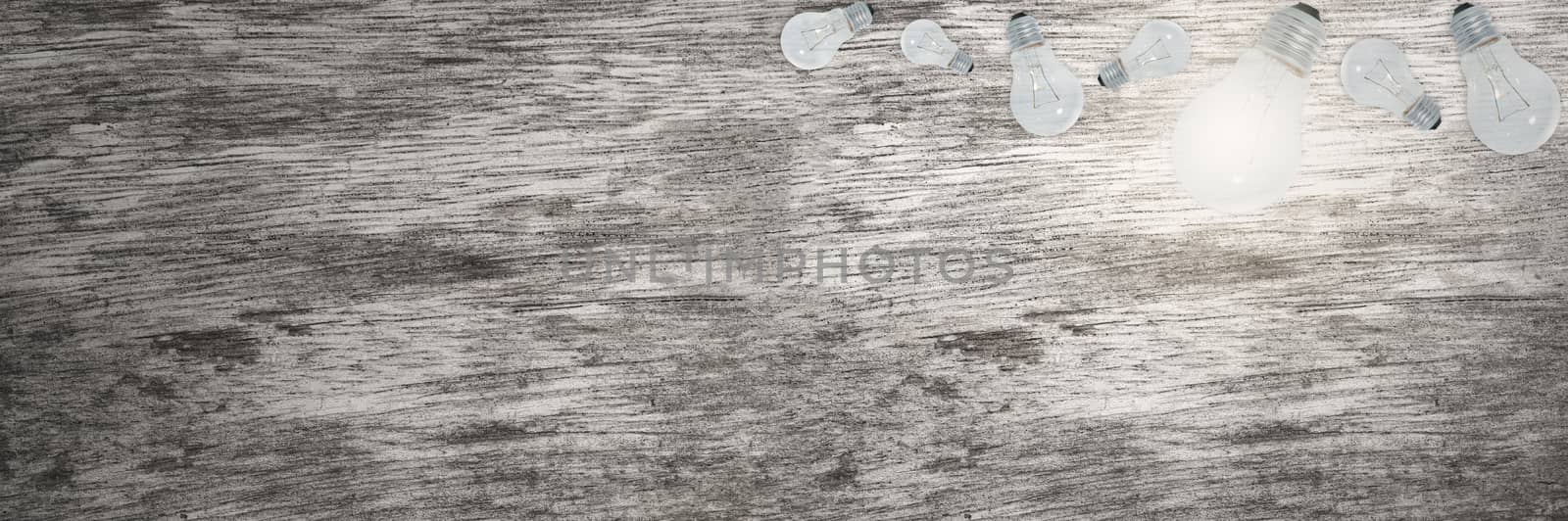 Light Bulbs Concept Wood Grain Background
