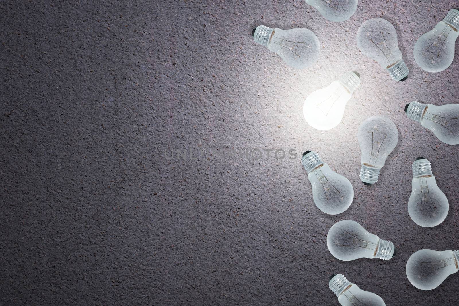 Light Bulbs Concept gray cement background