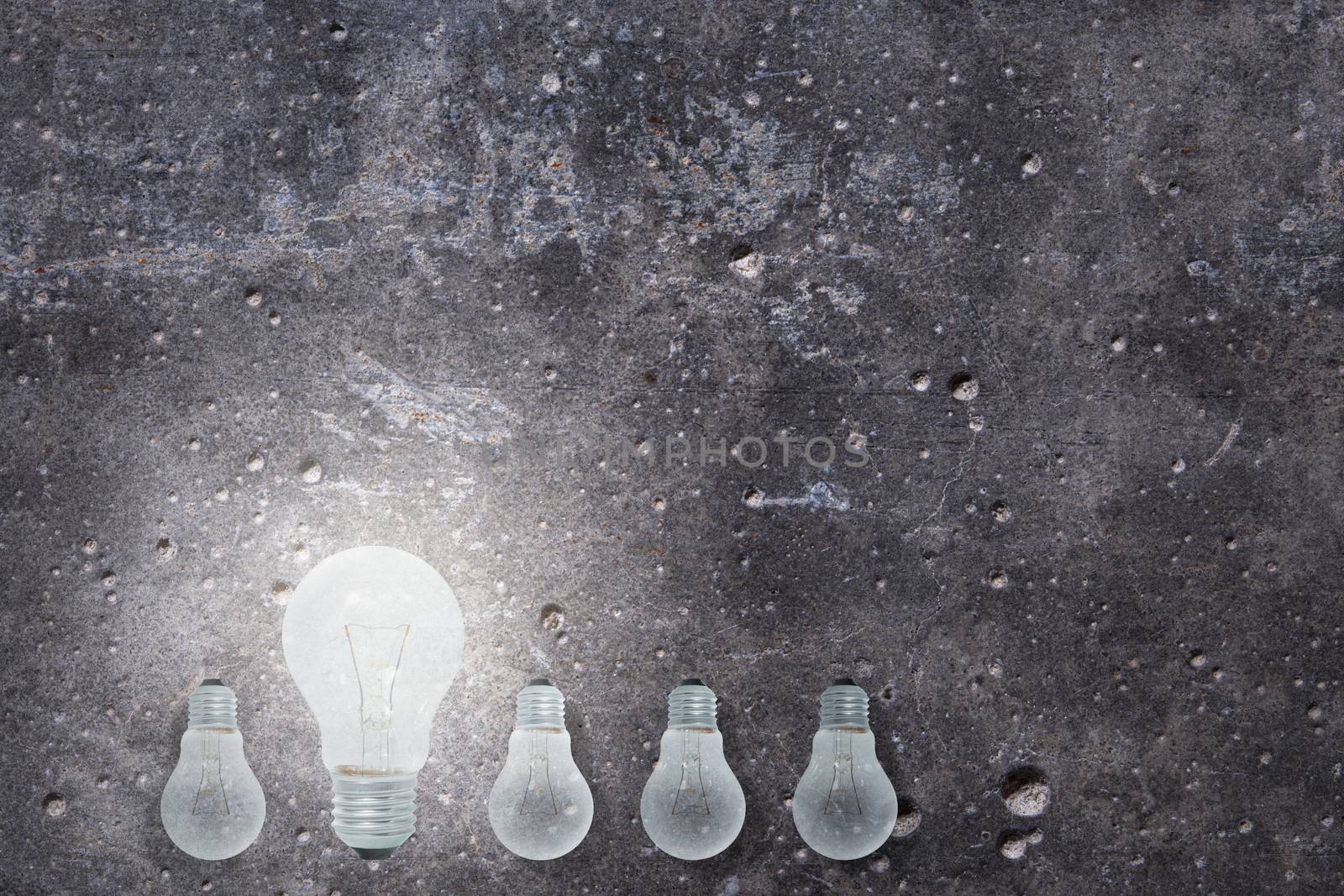 Light Bulbs Concept gray cement background