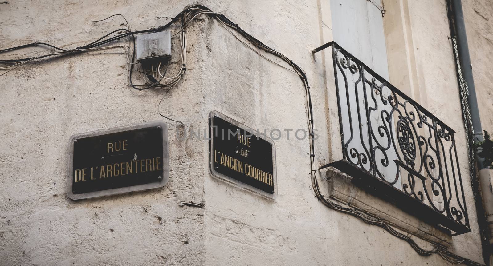 Montpellier, France - January 02, 2019: Street name plate in French - Rue de Argenterie and Rue de Ancien Courier in the historic city center on a winter day