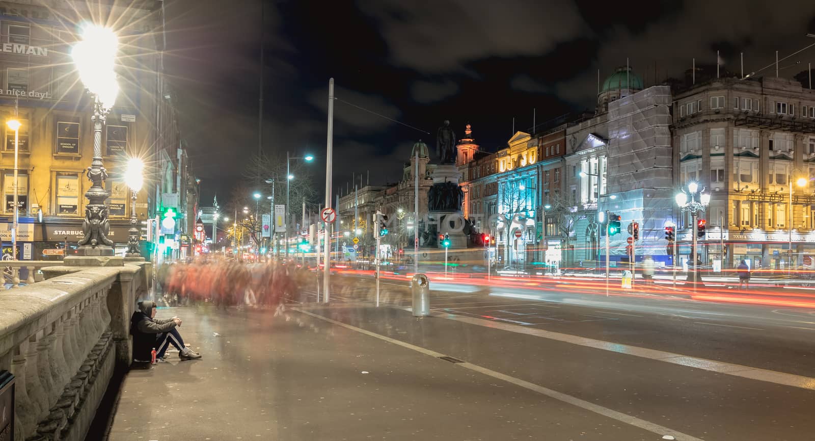 Dublin, Ireland - February 15, 2019: street atmosphere and architectural detail at night in the historic city center where people walk on a winter evening