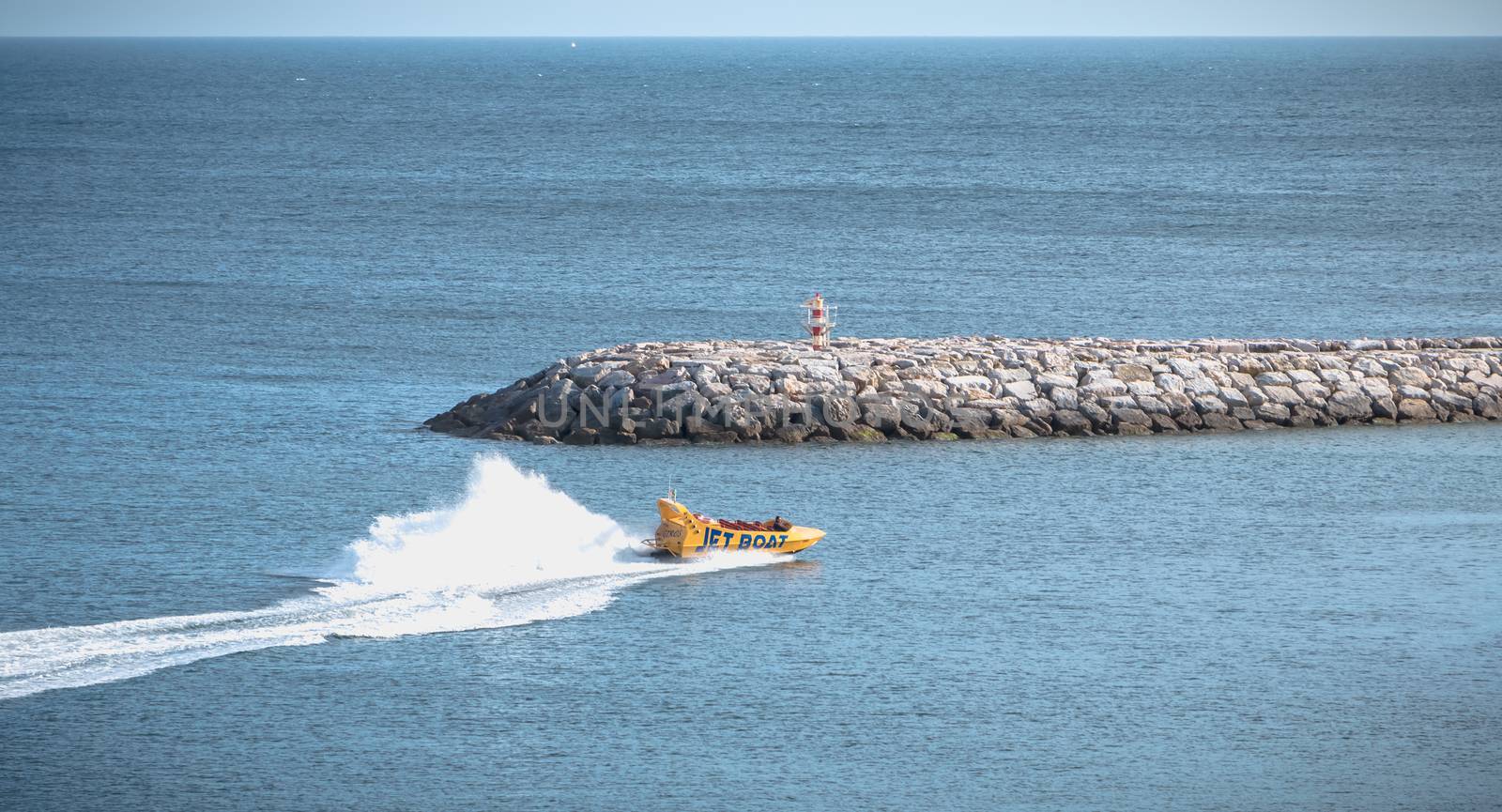 Jetboat for tourists entering the harbor of Albufeira, Portugal by AtlanticEUROSTOXX