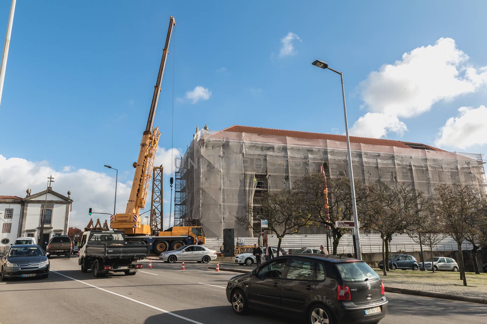 renovation site with a crane in operation and street atmosphere  by AtlanticEUROSTOXX