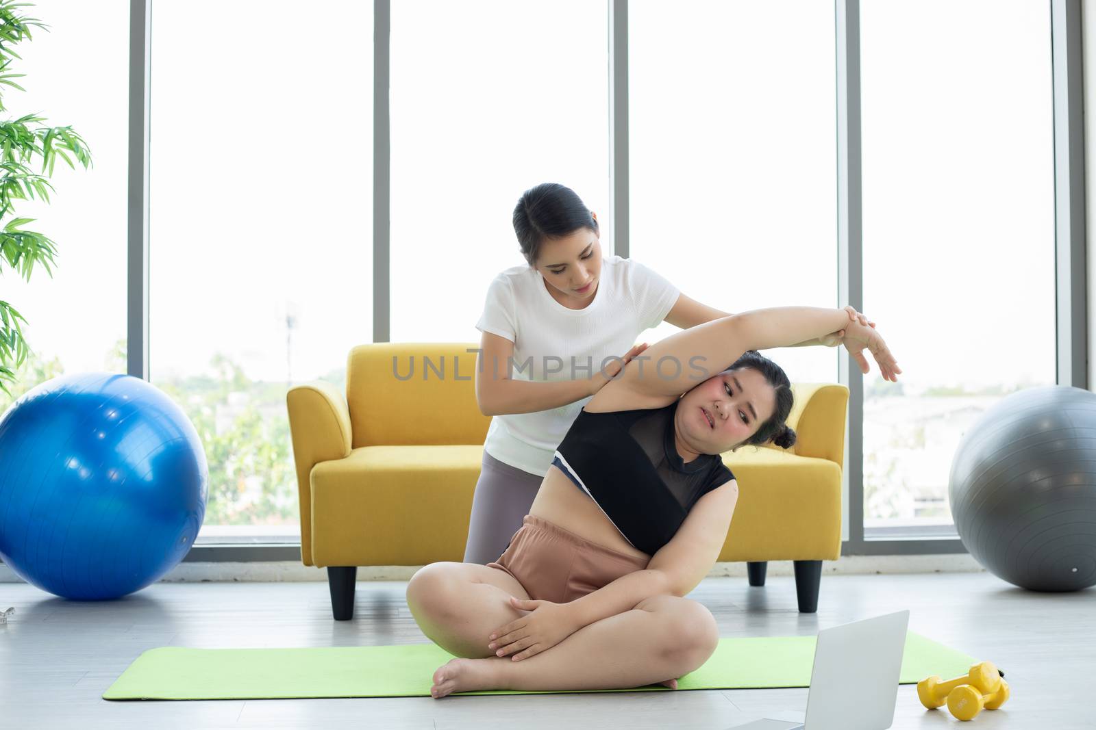 Asian woman yoga exercising at home  