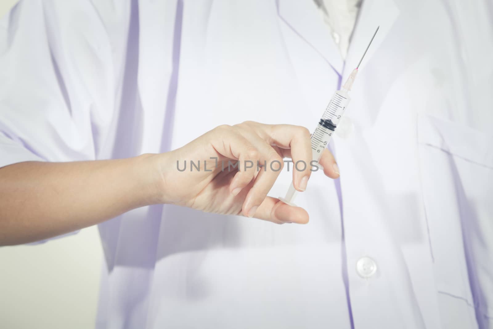 Doctor holding medical injection syringe  and Medicine plastic vaccination equipment with needle .Nurse or doctor. Liquid drug or narcotic for treatment coronavirus%2Fcovid-19, Health care in hospital.