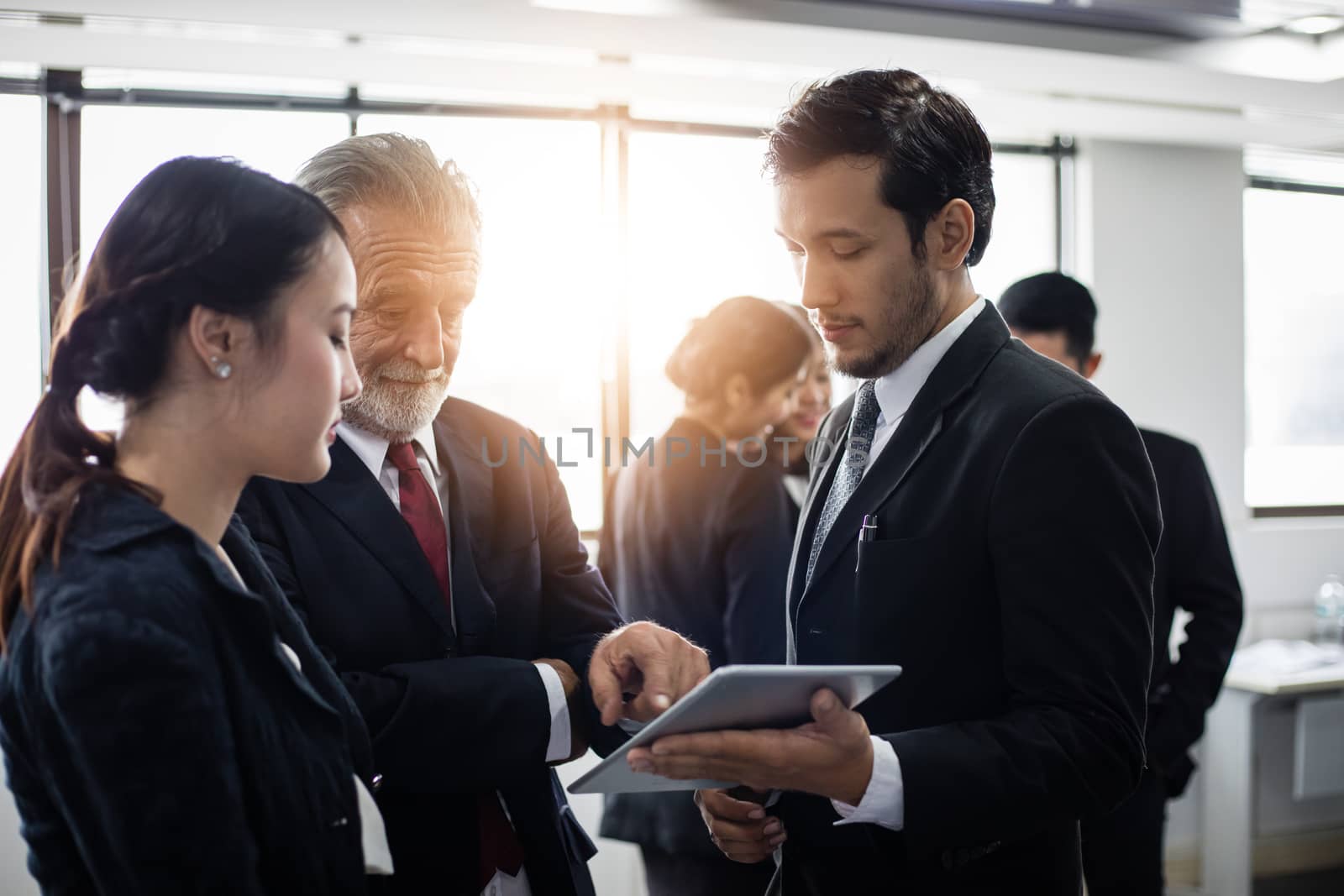 Group of Business People using tablet for Meeting Discussion Working Concept in meeting room