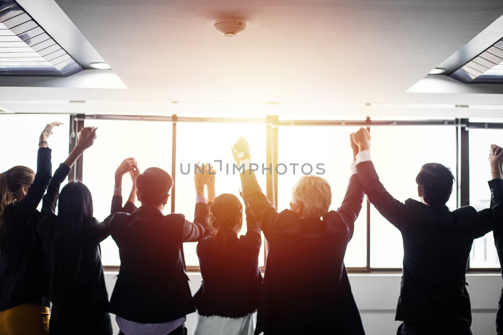 smiling happy Businessman and Businesswomen celebrating success Achievement Arm Raised and show thumb up Concept