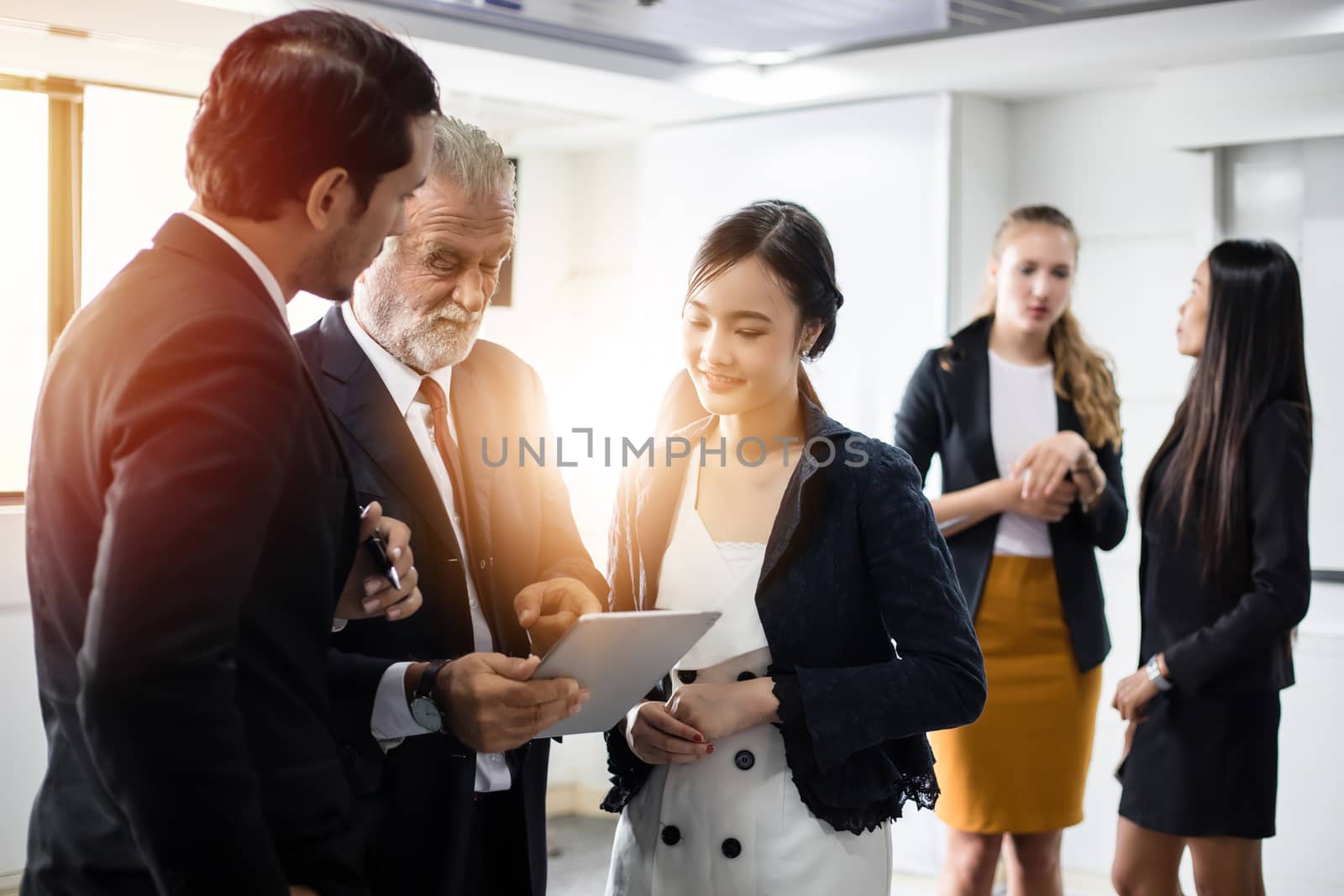 Group of Business People using tablet for Meeting Discussion Working Concept in meeting room