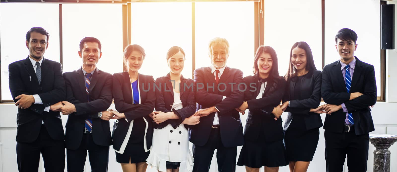 smiling happy Businessman and Businesswomen celebrating success Achievement Arm Raised and show thumb up Concept
