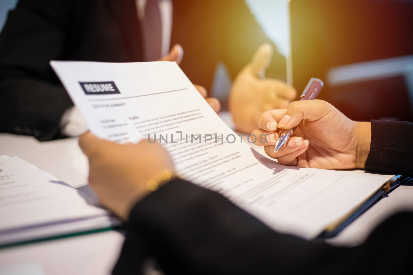 Businessmen and Businesswomen discussing documents and sign a business agreement for job interview concept