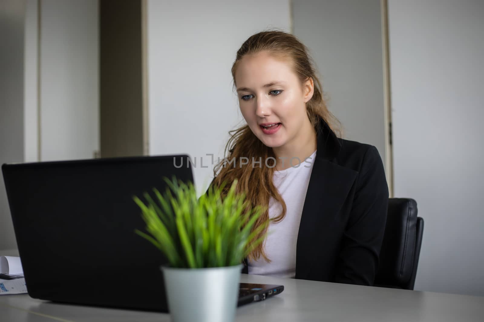 Asian businessmen and group using notebook for business partners discussing documents and ideas at meeting and business women smiling happy for working