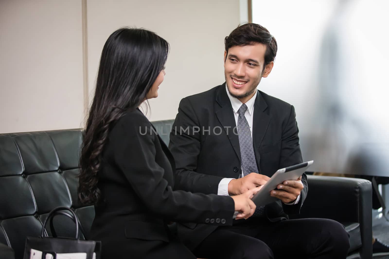 businessmen and group using notebook for business partners discussing documents and ideas at meeting and business women smiling happy for working