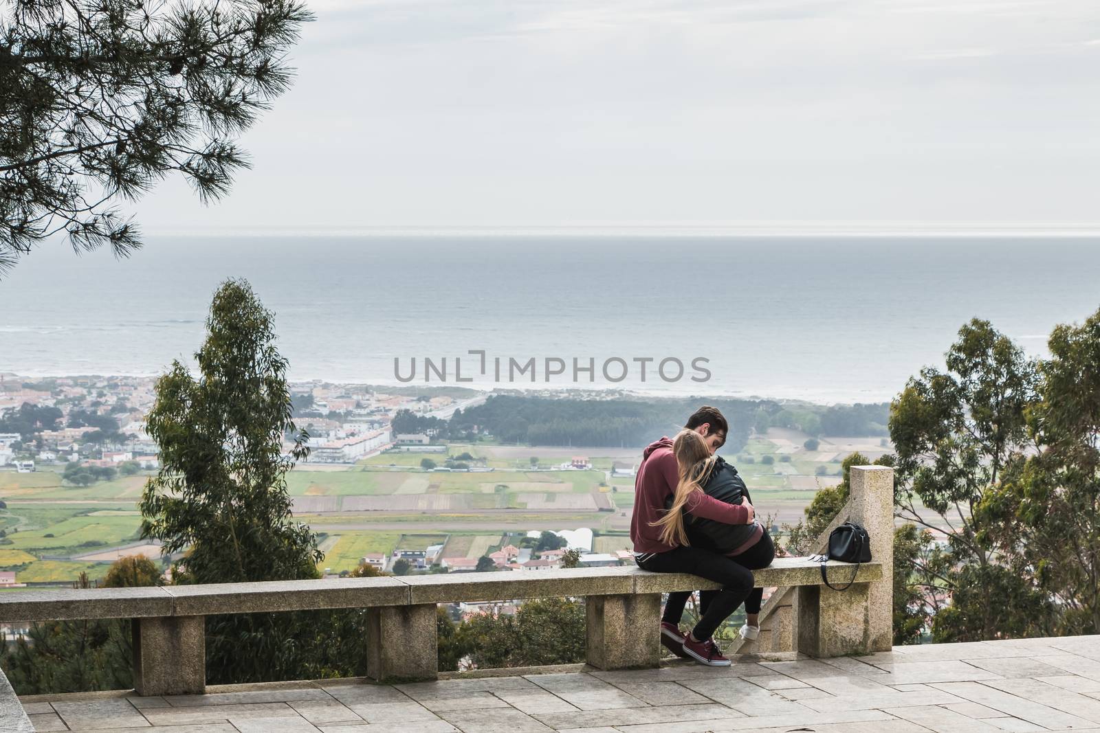 Vila Cha near Esposende - May 9, 2018: couple enjoying the panoramic view of Esposende on the entrance to the chapel of S. Lourenco on a spring day