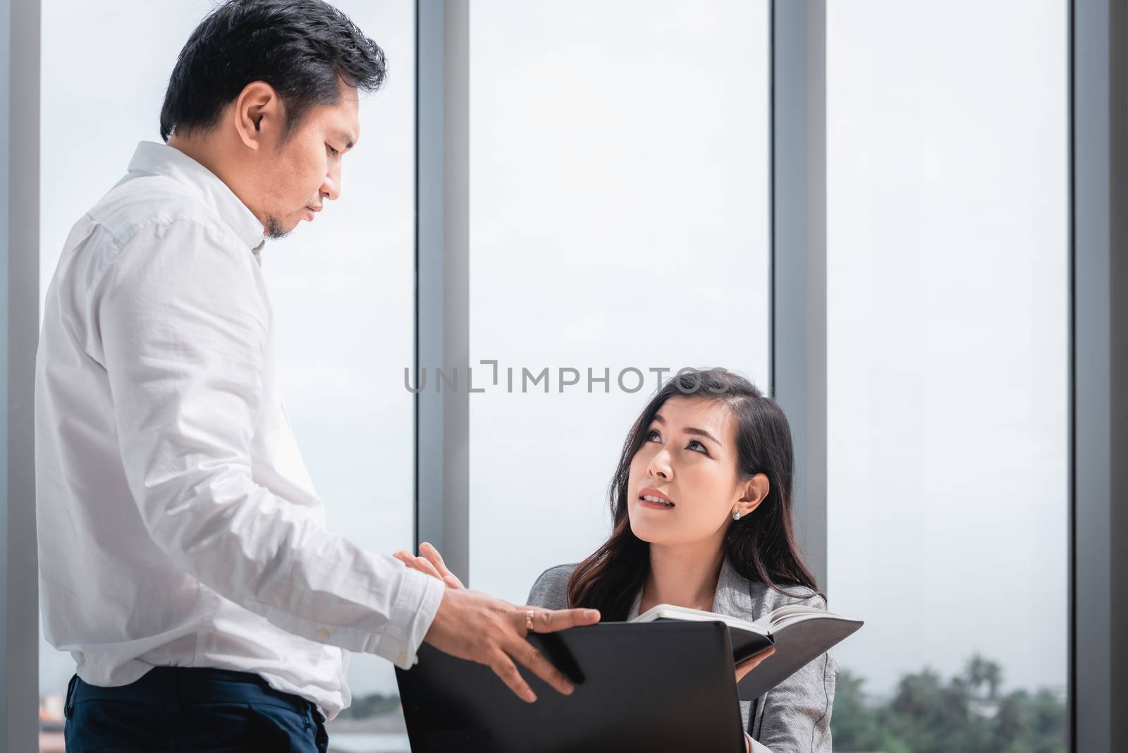 Businesspeople Teamwork are Seriously During Meeting Together, Business Woman Having Upset While Looking Result of Business Profit. Management Leader is Dissatisfied About Project Their Team Execution