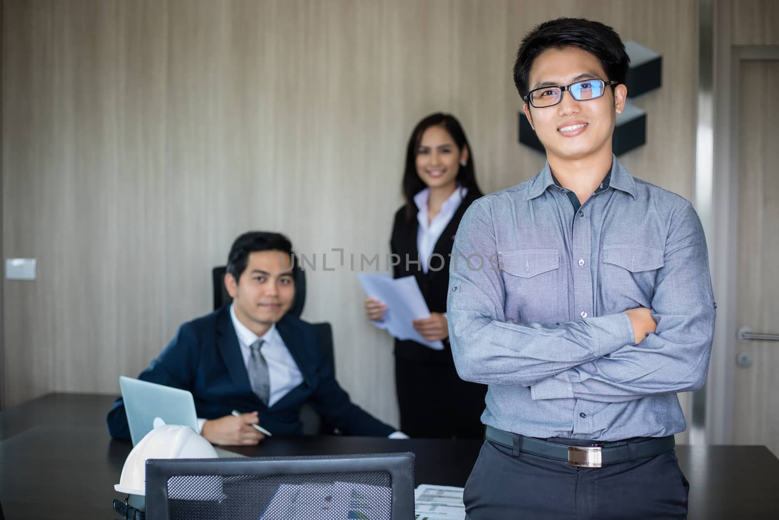Asian business man and group using notebook for meeting and business men smiling happy for working