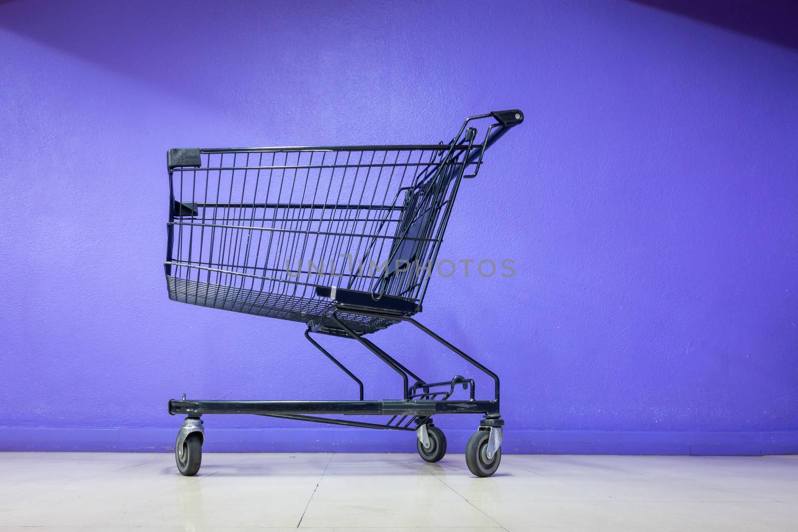 Empty Shopping Cart on Corridor Flooring in Department Store, Trolley Metal for Shopper Consumerism in Supermarket Shop. Shopping Roller Basket on The Floor Inside Customer Service Mall by MahaHeang245789
