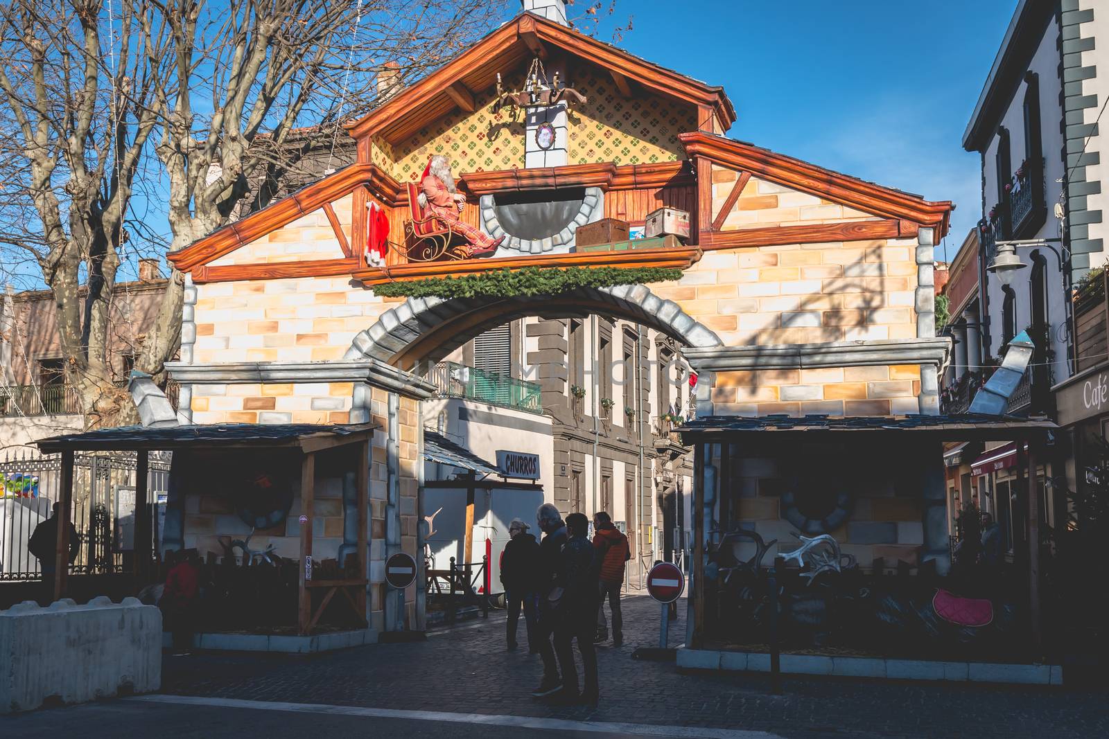 Marseillan, France - December 30, 2018: Santa Claus door mounted in the historic city center for the end of year and Christmas holidays