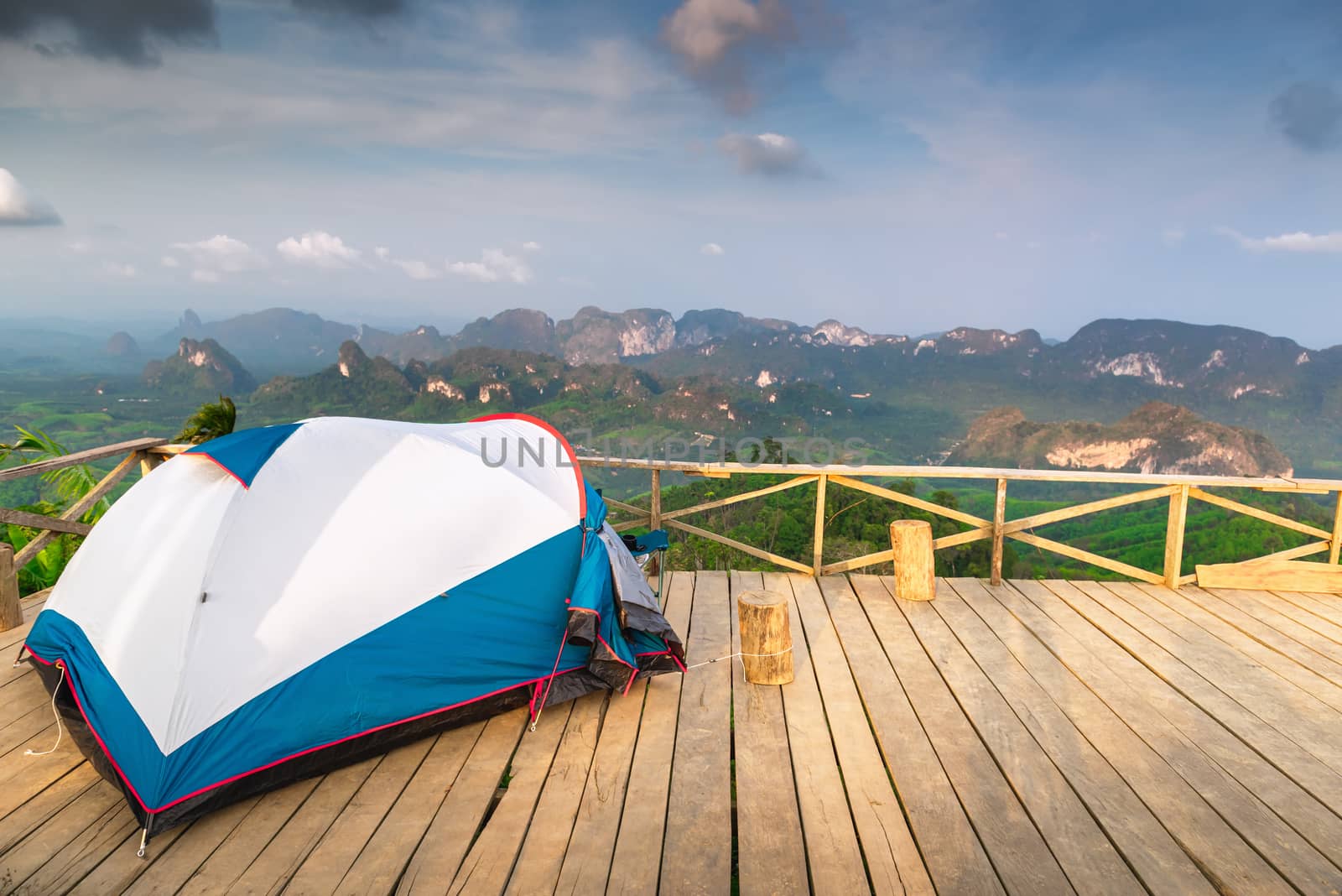 Landscape Scenery Mountains View With Camping Tent on Wooden Terrace for Outdoors Leisure Activity Relaxation. Beautiful Scenic of Nature From Campsite Viewpoint, Adventure/Vacation Lifestyle Concept.