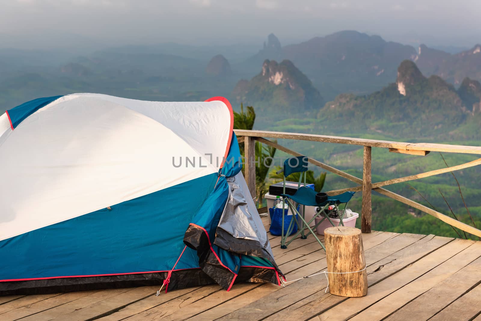 Landscape Scenery Mountains View With Camping Tent on Wooden Terrace for Outdoors Leisure Activity Relaxation. Beautiful Scenic of Nature From Campsite Viewpoint, Adventure/Vacation Lifestyle Concept. by MahaHeang245789