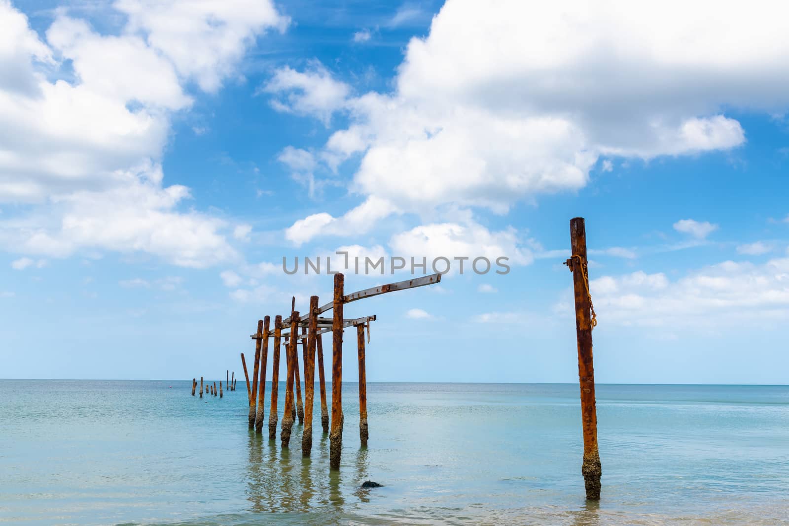 Landscape Seascape Scenery View With Old Bridge Structure Pole Against Blue Sky Background. Perspective Long Beach and Tropical Horizon Seaside View, Natural Backgrounds. by MahaHeang245789