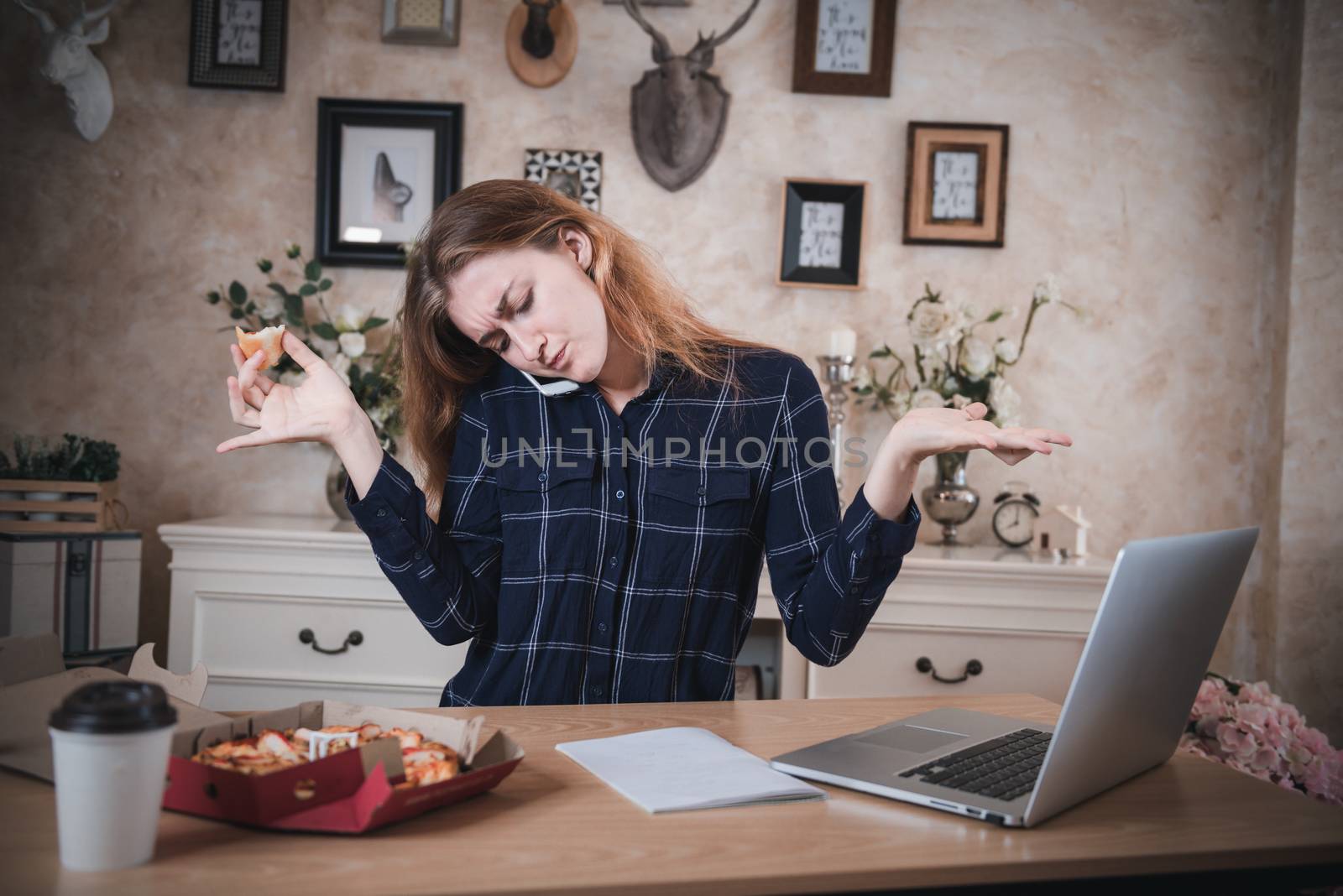 Busy Businesswoman Working at Home While Using Mobile Phone at The Same Time She Eating, Business Woman Entrepreneur Work From Home With Serious Communicating and Busy Tasking. Multitasking Lifestyles