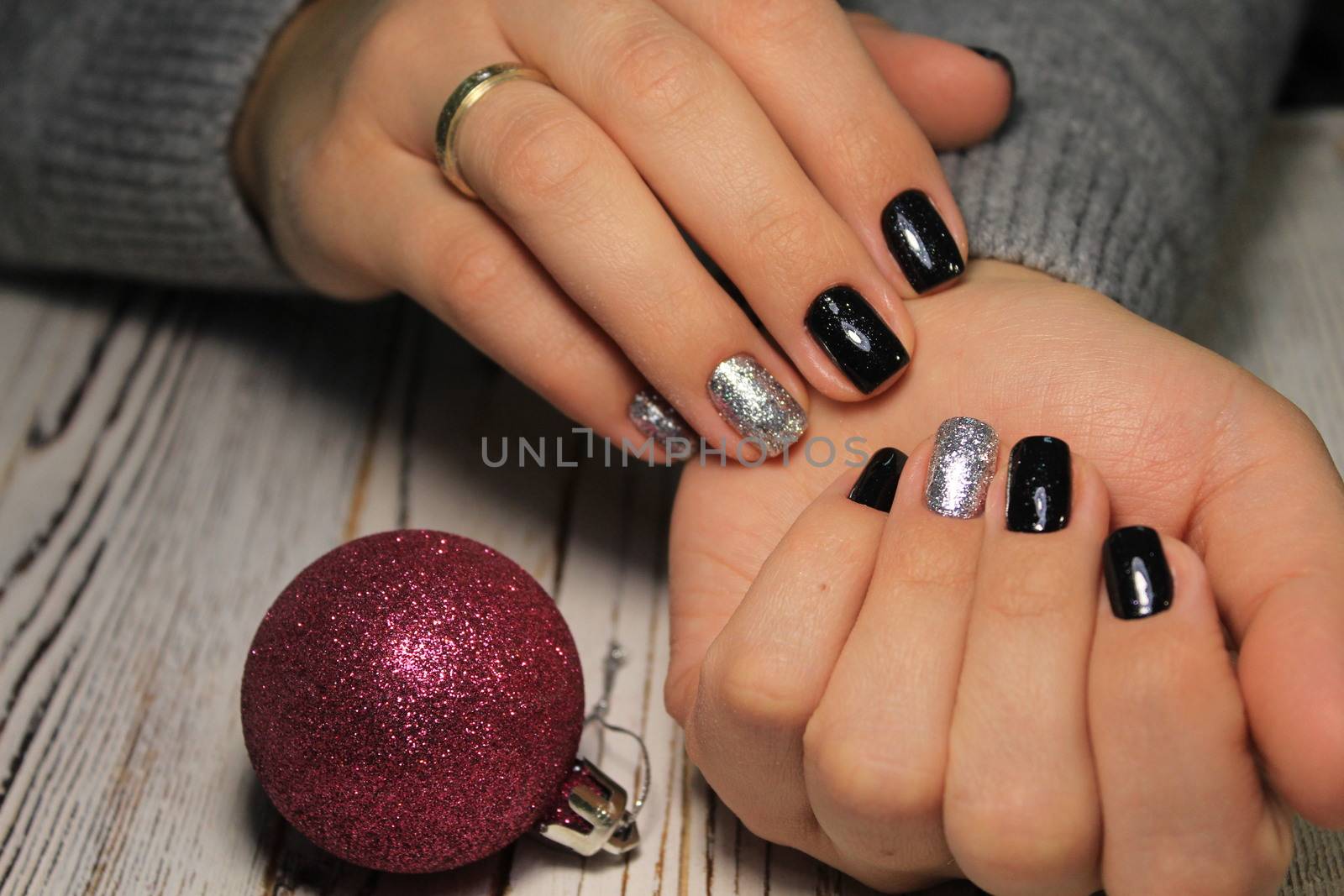 Beautiful woman's nails with beautiful christmas manicure studio