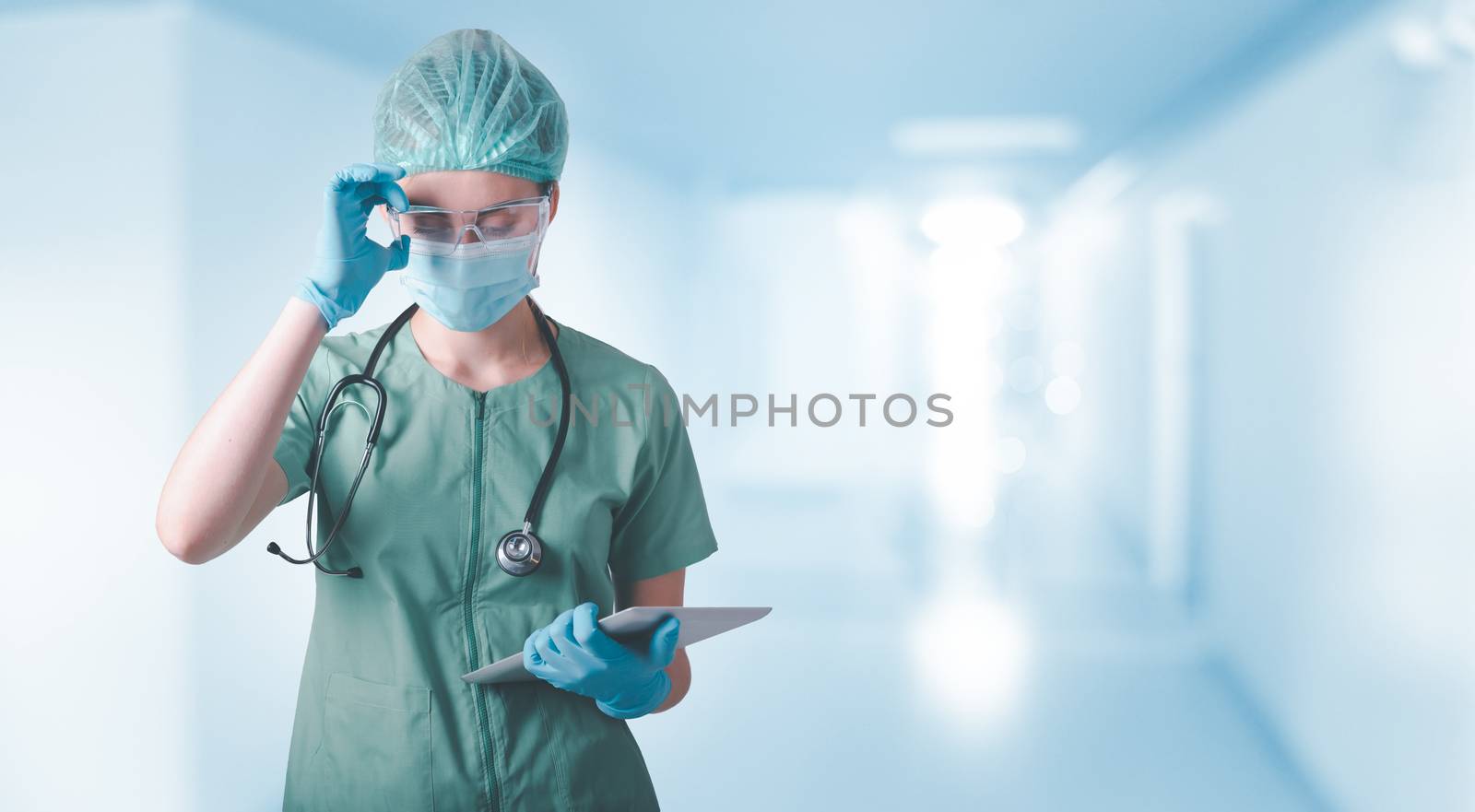 Medical Surgical Doctor and Health Care, Portrait of Surgeon Doctor in PPE Equipment in Examination Room. Medicine Female Doctors Wearing Face Mask and Cap for Patients Surgery Work. Medic Hospital